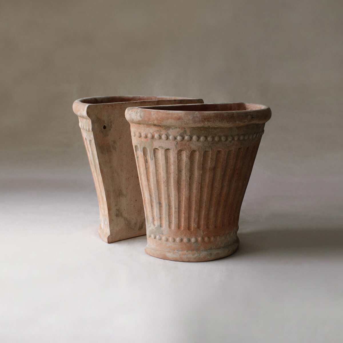 flat backed terracotta pot