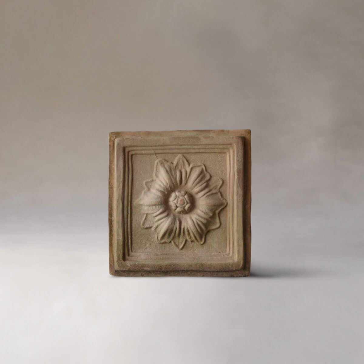 Terracotta plaque with flower